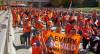 Participants pass the Canadian Museum for Human Rights during the Orange Shirt Day Survivors Walk in Winnipeg on Saturday. (David Lipnowski / Canadian Press)