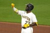 Pittsburgh Pirates' Andrew McCutchen celebrates as he stands on second base after driving in a run with a double off Milwaukee Brewers starting pitcher Corbin Burnes during the fifth inning of a baseball game in Pittsburgh, Monday, Sept. 4, 2023. (AP Photo/Gene J. Puskar)
