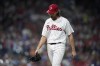 Philadelphia Phillies pitcher Aaron Nola walks of the field after being pulled during the fifth inning of a baseball game against the Miami Marlins, Saturday, Sept. 9, 2023, in Philadelphia. (AP Photo/Matt Slocum)