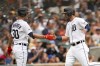 Detroit Tigers' Kerry Carpenter (30) and Matt Vierling celebrate scoring against the Chicago White Sox in the third inning of a baseball game, Sunday, Sept. 10, 2023, in Detroit. (AP Photo/Paul Sancya)