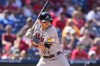 Atlanta Braves' Austin Riley is hit by a pitch from Philadelphia Phillies pitcher Taijuan Walker during the fifth inning of the first baseball game in a doubleheader, Monday, Sept. 11, 2023, in Philadelphia. (AP Photo/Matt Slocum)