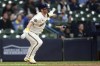 Milwaukee Brewers' Josh Donaldson hits an RBI single during the third inning of a baseball game against the Miami Marlins, Monday, Sept. 11, 2023, in Milwaukee. (AP Photo/Aaron Gash)