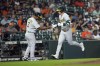 Oakland Athletics' Brent Rooker, right, celebrates with third base coach Eric Martins (3) after hitting a home run against the Houston Astros during the second inning of a baseball game Monday, Sept. 11, 2023, in Houston. (AP Photo/David J. Phillip)