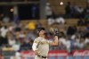 San Diego Padres shortstop Xander Bogaerts catches a hit by Los Angeles Dodgers' Jason Heyward during the second inning of a baseball game, Monday, Sept. 11, 2023, in Los Angeles. (AP Photo/Ryan Sun)