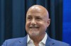 FILE - Washington Nationals general manager Mike Rizzo smiles during a media availability at Nationals Park, Saturday, July 22, 2023, in Washington. The Nationals are giving longtime president of baseball operations and general manager Mike Rizzo a chance to finish what he started. The club signed Rizzo to a multi-year extension on Wednesday, Sept. 13. (AP Photo/Alex Brandon, File)