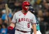 Los Angeles Angels' Mike Moustakas reacts to striking out on a foul tip against the Seattle Mariners during the first inning of a baseball game, Tuesday, Sept. 12, 2023, in Seattle. (AP Photo/Lindsey Wasson)