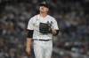 New York Yankees starting pitcher Clarke Schmidt reacts to a play during the fifth inning of the team's baseball game against the Toronto Blue Jays on Tuesday, Sept. 19, 2023, in New York. (AP Photo/Bryan Woolston)