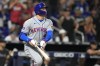 New York Mets' Brandon Nimmo watches his two-run double during the ninth inning of the team's baseball game against the Miami Marlins, Tuesday, Sept. 19, 2023, in Miami. (AP Photo/Lynne Sladky)