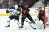 Ottawa Senators goaltender Leevi Merilainen (35) keeps his eye on the puck as Ottawa Senators defenceman Thomas Chabot (72) push Winnipeg Jets centre Dominic Toninato (21) off the net during first period pre-season NHL hockey action in Ottawa on Friday, Sept. 29, 2023. THE CANADIAN PRESS/Sean Kilpatrick