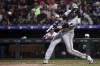 Minnesota Twins first baseman Alex Kirilloff hits a ground-rule double in the third inning of a baseball game against the Colorado Rockies, Saturday, Sept. 30, 2023, in Denver. (AP Photo/Geneva Heffernan)