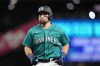 Seattle Mariners' Cal Raleigh reacts after flying out against the Texas Rangers during the eighth inning of a baseball game, Saturday, Sept. 30, 2023, in Seattle. (AP Photo/Lindsey Wasson)