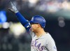 Texas Rangers' Nathaniel Lowe reacts to hitting an RBI single against the Seattle Mariners during the third inning of a baseball game, Saturday, Sept. 30, 2023, in Seattle. (AP Photo/Lindsey Wasson)