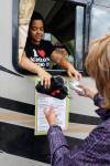 MIKE DEAL / WINNIPEG FREE PRESS Files
                                Ally Seidlitz hands over supplies to a participant at the Sunshine House RV or MOPS (Mobile Overdose Prevention Site) Aug. 16.