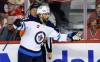 Winnipeg Jets forward Alex Iafallo celebrates his goal during second period NHL hockey action against the Calgary Flames in Calgary, Wednesday, Oct. 11, 2023. (Jeff McIntosh / The Canadian Press)