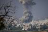 Ariel Schalit / The Associated Press
                                Smoke rises following an Israeli airstrike in the Gaza Strip, as seen from southern Israel, Monday.