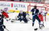 JOHN WOODS / WINNIPEG FREE PRESS
                                New York Rangers&rsquo; Artemi Panarin scores on Winnipeg Jets goaltender Connor Hellebuyck during the first period in Winnipeg on Monday.