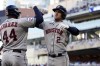 Houston Astros' Alex Bregman (2) is greeted by Yordan Alvarez after a solo home run in the fifth inning of Game 3 in an American League Division Series baseball game against the Minnesota Twins, Tuesday, Oct. 10, 2023, in Minneapolis. (AP Photo/Jordan Johnson)