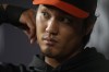 Baltimore Orioles relief pitcher Shintaro Fujinami is pictured in the dugout with a scar on his chin and a wrap on his hand in the fifth inning of Game 3 of a baseball AL Division Series on Tuesday, Oct. 10, 2023, in Arlington, Texas. (AP Photo/Julio Cortez)