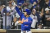 New York Mets' Francisco Lindor reacts at home plate after hitting a two-run home run during the fourth inning of the second game of a baseball doubleheader against the Philadelphia Phillies, Saturday, Sept. 30, 2023, in New York. (AP Photo/Mary Altaffer)