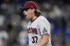 Arizona Diamondbacks relief pitcher Kevin Ginkel reacts after getting Los Angeles Dodgers' Chris Taylor to ground into a double play during the eighth inning in Game 2 of a baseball NL Division Series, Monday, Oct. 9, 2023, in Los Angeles. (AP Photo/Ashley Landis)