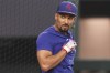 Texas Rangers' Marcus Semien takes batting practice before Game 3 of the baseball team's AL Division Series against the Baltimore Orioles in Arlington, Texas, Tuesday, Oct. 10, 2023. (AP Photo/LM Otero)