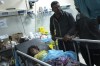 Relatives stand next to a child wounded in the Israeli bombardment of the Gaza Strip in a hospital in Khan Younis, Tuesday, Oct. 17, 2023. (AP Photo/Fatima Shbair)