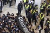 Demonstrators, calling for a ceasefire in the ongoing war between Israel and Hamas, are detained by U.S. Capitol Police during a protest inside the Cannon House Office Building at the Capitol in Washington on Wednesday, Oct. 18, 2023. (AP Photo/Amanda Andrade-Rhoades)