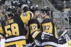 Pittsburgh Penguins' Adam Johnson (47) celebrates with Sidney Crosby (87) and Kris Letang (58) after scoring against the Columbus Blue Jackets during the second period of an NHL preseason hockey game, Saturday, Sept. 22, 2018, in Pittsburgh.&nbsp;Members of the Winnipeg Jets expressed their support for Adam Johnson, a former NHL player who suffered a serious injury while playing professionally in England on Saturday, leading to the game being abandoned. THE CANADIAN PRESS/AP, Keith Srakocic