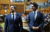 Prime Minister Justin Trudeau and Conservative Leader Pierre Poilievre wait to continue escorting Newly elected Speaker of the House of Commons Greg Fergus to his seat on Parliament Hill in Ottawa on Tuesday, Oct. 3, 2023. The Conservative party is maintaining a steady lead over Prime Minister Justin Trudeau's Liberals, a new poll suggests, at a time when Canadians are reporting limited trust in their institutions.THE CANADIAN PRESS/Sean Kilpatrick