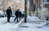 Police investigate the scene at 143 Langside St. on Sunday. (John Woods / Winnipeg Free Press)