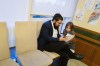 An Israeli refugee and his daughter sit together in a Jewish refugee camp in Balatonoszod, Hungary, Tuesday Nov. 7, 2023. The camp, which houses around 250 people, including 100 children, provides shelter for Jewish refugees, some of whom escaped war both in Ukraine and Israel. (AP Photo/Bela Szandelszky)
