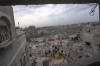 Palestinians look for survivors following an Israeli airstrike in Khan Younis, southern Gaza Strip, Sunday, Nov. 12, 2023.&nbsp;Scores of Canadians are still hoping to leave the Gaza Strip, as Canadians and Israelis mourn the loss of dual national Vivian Silver in last month's attack by Hamas.THE CANADIAN PRESS/AP, Fatima Shbair