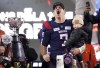 Montreal Alouettes quarterback Cody Fajardo (7) holds his son Luca as he celebrates defeating the Winnipeg Blue Bombers to win the 110th CFL Grey Cup in Hamilton, Ont., on Sunday, Nov. 19, 2023. THE CANADIAN PRESS/Frank Gunn