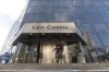 People enter the Law Courts in Winnipeg on February 5, 2018. The Crown has stayed sex assault charges against a former Manitoba high school teacher and coach. THE CANADIAN PRESS/John Woods