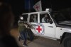 A Red Cross vehicle carrying Israeli hostages drives by at the Gaza Strip crossing into Egypt in Rafah on Saturday, Nov. 25, 2023. Jewish and Muslim groups in Canada say they are closely following the ongoing ceasefire between Israel and Hamas. THE CANADIAN PRESS/AP/Fatima Shbair