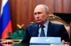 Russian President Vladimir Putin listens to VTB Bank Chairman Andrei Kostin during their meeting in Moscow, Russia, Monday, Nov. 27, 2023. (Mikhail Klimentyev, Sputnik, Kremlin Pool Photo via AP)