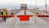 City of Winnipeg crews install barriers on the north end of the Arlington Bridge. The bridge, which opened in 1912, has been closed indefinitely for safety reasons.  (Mike Deal / Winnipeg Free Press)
231122 - Wednesday, November 22, 2023.