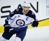 Winnipeg Jets forward Adam Lowry skates during first period NHL hockey action against the Calgary Flames in Calgary, Wednesday, Oct. 11, 2023.THE CANADIAN PRESS/Jeff McIntosh