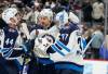 David Zalubowski / The Associated Press
                                Winnipeg Jets Josh Morrissey (left), Nino Niederreiter and Connor Hellebuyck congratulate each other following Thursday night&rsquo;s victory over the Colorado Avalanche.