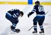 FRED GREENSLADE/ THE CANADIAN PRESS
                                Nate Schmidt (right) comes to the aid of Jets teammate Mark Scheifele after he was hit in the head with a shot Tuesday against the Columbus Blue Jackets.