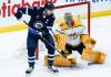 John Woods / THE CANADIAN PRESS files
                                Winnipeg Jets captain Adam Lowry distracts Nashville Predators goaltender Juuse Saros.