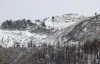 FILE - In this photo provided by the California Department of Water Resources, the snow level on a mountain peak is seen near the meadow where the first snow survey of the year took place in Phillips Station, Calif., Jan. 2, 2024. Once regularly snowbound river basins across the globe are increasingly seeing their snowpack shrink and climate change is to blame, a new study found. (Fred Greaves/California Department of Water Resources via AP, File)