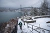 A person walks down the snow-covered steps at Prospect Point near the Lions Gate Bridge as snow falls in Vancouver on Saturday, February 13, 2021.&nbsp;Metro Vancouver, Greater Victoria, and the Fraser Valley are expecting frigid wind chills to arrive tonight, joining much of the rest of British Columbia, Saskatchewan and all of Alberta under various cold weather warnings. THE CANADIAN PRESS/Darryl Dyck