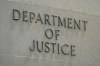 The U.S. Department of Justice says it has charged two Canadians and an Iranian in a murder-for-hire plot targeting two people in Maryland. An exterior sign is photographed outside the Robert F. Kennedy Department of Justice building in Washington on May 4, 2021. THE CANADIAN PRESS/AP/Patrick Semansky