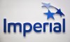 Imperial Oil Ltd. raised its quarterly dividend by 20 per cent as it reported a fourth-quarter profit of $1.37 billion, down from $1.73 billion a year earlier. An Imperial Oil logo is shown at the company's annual meeting in Calgary on Friday, April 28, 2017. THE CANADIAN PRESS/Jeff McIntosh