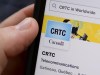 A person navigates to the on-line social-media pages of the Canadian Radio-television and Telecommunications Commission (CRTC) on a cell phone in Ottawa on Monday, May 17, 2021.&nbsp;New Brunswick-based rural internet company Xplore Inc. says a national framework that allows smaller providers to offer services to customers by using larger companies' fibre networks would give residents of remote regions more affordable options. THE CANADIAN PRESS/Sean Kilpatrick
