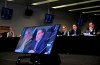 Mirko Bibic, president and CEO of BCE and Bell Canada is seen on television screens as he speaks during a CRTC hearing in Gatineau, Que., on Wednesday, Feb. 19, 2020. Members of Parliament have invited several top executives from BCE Inc. and Bell Canada to testify later this month about the company's decision to cut about nine per cent of its workforce this year. THE CANADIAN PRESS/Justin Tang