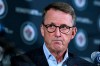 Winnipeg Jets chairman Mark Chipman says the NHL team's future could be in jeopardy if attendance doesn't improve. Chipman listens to General Manager Kevin Cheveldayoff's response to a question during a press conference in Winnipeg, Tuesday, Nov. 2, 2021. THE CANADIAN PRESS/Fred Greenslade