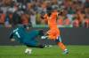 SUNDAY ALAMBA / THE ASSOCIATED PRESS
                                Ivory Coast&rsquo;s Jonathan Bamba scampers around DR Congo goalkeeper Lionel Mpasi during an African Cup of Nations semifinal match on Wednesday.