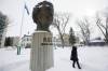 A woman visits the Louis Riel statue during a Louis Riel Day celebration at Le Musée de Saint Boniface on Feb. 20, 2023. (JOHN WOODS / FREE PRESS FILES)